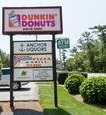 Plaza sign on Cranberry Highway above Dunkin Donuts